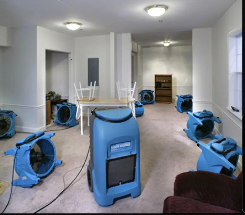Air movers and dehumidifier setup for Water Damage Restoration in Newtown